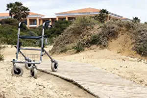 Disability Prints: Walking frame left on the beach