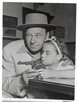 Wallace Beery with Daughter Carol Ann and Gun