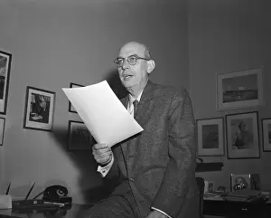 Wallace Bennett Holding a Document