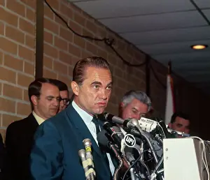 Wallace Talking With Reporters