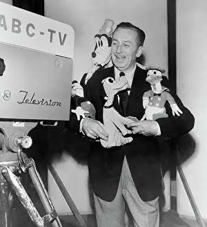Stuffed Animal Prints: Walt Disney Holding Cartoon Stuffed Characters
