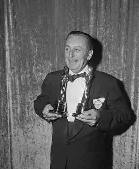 Looking Sideways Prints: Walt Disney Holding Oscar Awards