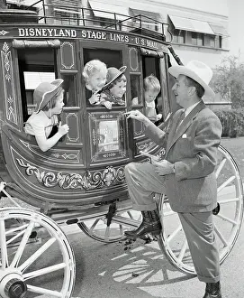 Stagecoach Prints: Walt Disney Holding Up Stagecoach Full of Children