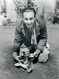 Walt Disney Kneeling on Lawn