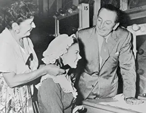 Walt Disney Observing His Daughter in Makeup Session