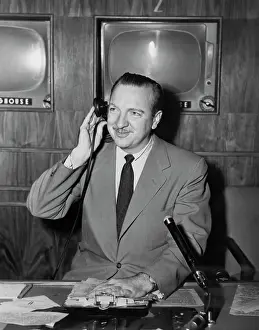 Walter Cronkite At Work In TV Studio