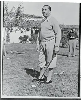 Walter Hagen Poised on the Green With Golf Club