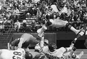 Audience Prints: Walter Payton Jumps Over Gary Hrivnak in Game
