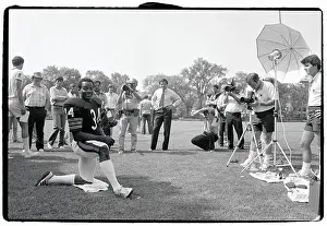 Walter Payton Poses on One Knee for Photographers