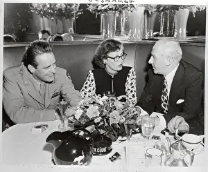 Walter Winchell Sitting at Table with Mr. and Mrs. Elliot Roosevelt