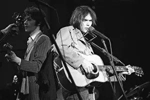 Prints of SAN FRANCISCO - NOVEMBER 25: Musician Neil Young performs on stage at The Band's The Last Waltz concert at Winterland Ballroom on November 25, 1976 in San Francisco, California Echoes of a Legend: Celebrating the Enduring Spirit of a Music Icon: The Last Waltz Concert