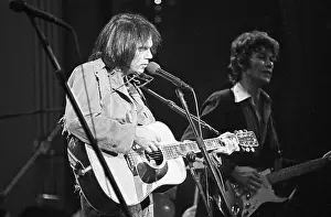 Prints of SAN FRANCISCO - NOVEMBER 25: Musician Neil Young performs on stage at The Band's The Last Waltz concert at Winterland Ballroom on November 25, 1976 in San Francisco, California Echoes of a Legend: Celebrating the Enduring Spirit of a Music Icon: The Last Waltz Concert