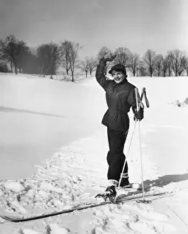 Wan cross-country skiing, waving, (B&W)