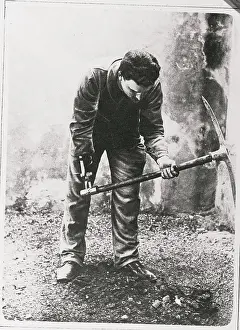 Difficult Prints: War Veteran Wielding Pick with Artificial Hand