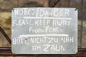 Images Dated 3rd September 2012: Warning sign in English and German on the fence of a predator enclosure, Namibia