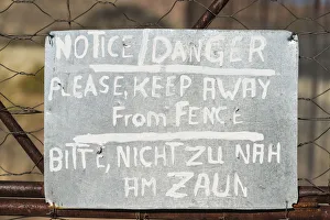 Images Dated 3rd September 2012: Warning sign in English and German on the fence of a predator enclosure, Namibia