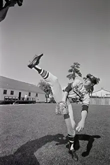 Warren Spahn Pitching a Baseball