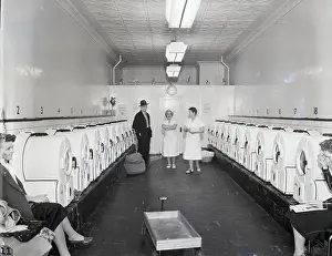 Employee Prints: Washing Machines in Automatic Laundromat
