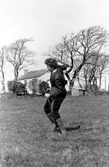 Prints of Professional water diviner Catherine Bent at work in Cornwall, where she is employed by a farmer. Original Publication: Picture Post - 6497 - Picture Post Watches A Water Diviner - pub A Photographic Legacy: Water Diviner