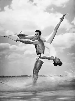 Water-Skiing Pair Performing Stunt