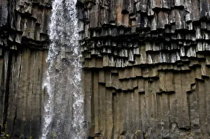 Waterfall with basalt columns in Skaftafell National Park, Iceland, Europe Waterfall with basalt columns in Skaftafell National Park, Iceland, Europe