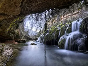 Waterfall view from inside a cave