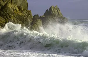 Wave breaking on beach, dusk