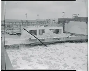 Waves Crashing Against a Small Beach Restaurant