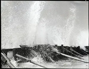 Splashing Prints: Waves Dashing Against Breakwater