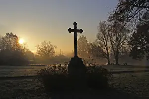 Wayside cross near a pond, early morning with sunrise, district of Mittelberg, Biberach, Upper Swabia, Baden-Wuerttemberg, Germany, Europe