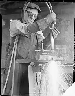 Welder Cuts Through Steel with Torch