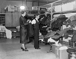 Welfare Agent Fitting Alien With Clothes
