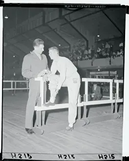 Wes Santee Showing His Leg to Tom Rosandich