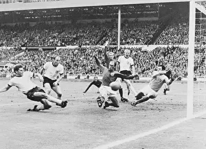 Prints of (Original Caption) 7/30/1966-Wembley Kicking Through History:Iconic Soccer Moments: West Germany and England in World Cup Action