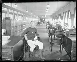 W.F. Warms Sitting in a Chair