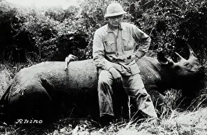Rhinoceros Prints: W.H. Herren Sitting on Rhinoceros