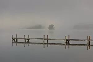 Wharf in the fog on Lake Staffelsee with the island of Woerth near Seehausen, Murnau, Upper Bavaria, Bavaria, Germany