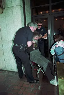 Denver Prints: Wheelchair Bound Protester Blocking Building Entrance
