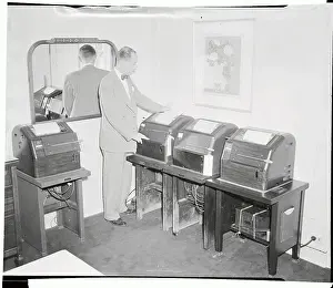 White House Official Checking Teletype Machines