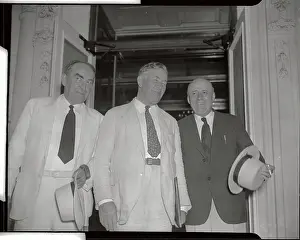 White House Officials Standing with Hats in Hand