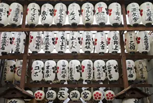 White Japanese Paper Lanterns Hanging In A Street