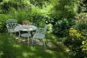 Canada Gallery: White metal garden table and chairs in a residential backyard, Quebec City, Quebec Province, Canada