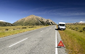 White van parked on the roadside, breakdown triangle, breakdown, Craigieburn Range, Canterbury, South Island White van parked on the roadside, breakdown triangle, breakdown, Craigieburn Range, Canterbury, South Island