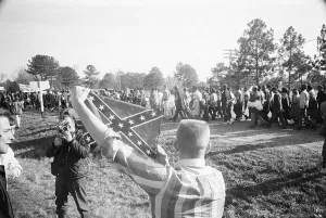 Selma Prints: White Youth Holding Confederate Flag at March