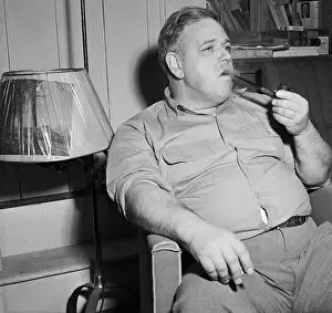 Whittaker Chambers Smoking a Pipe