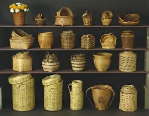 Wicker baskets and bowls on shelf