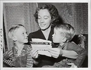 Wife of War Hero Reading to Her Children