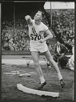 Wilbur Thompson Tossing in Olympic Shot Put