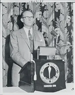Willard Libby Standing Behind a Podium
