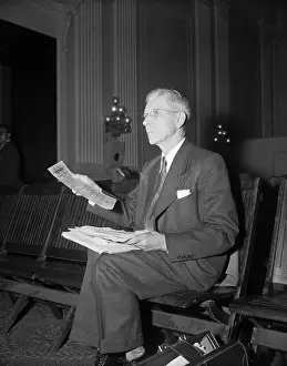 Willard Uphaus Sitting in Chair
